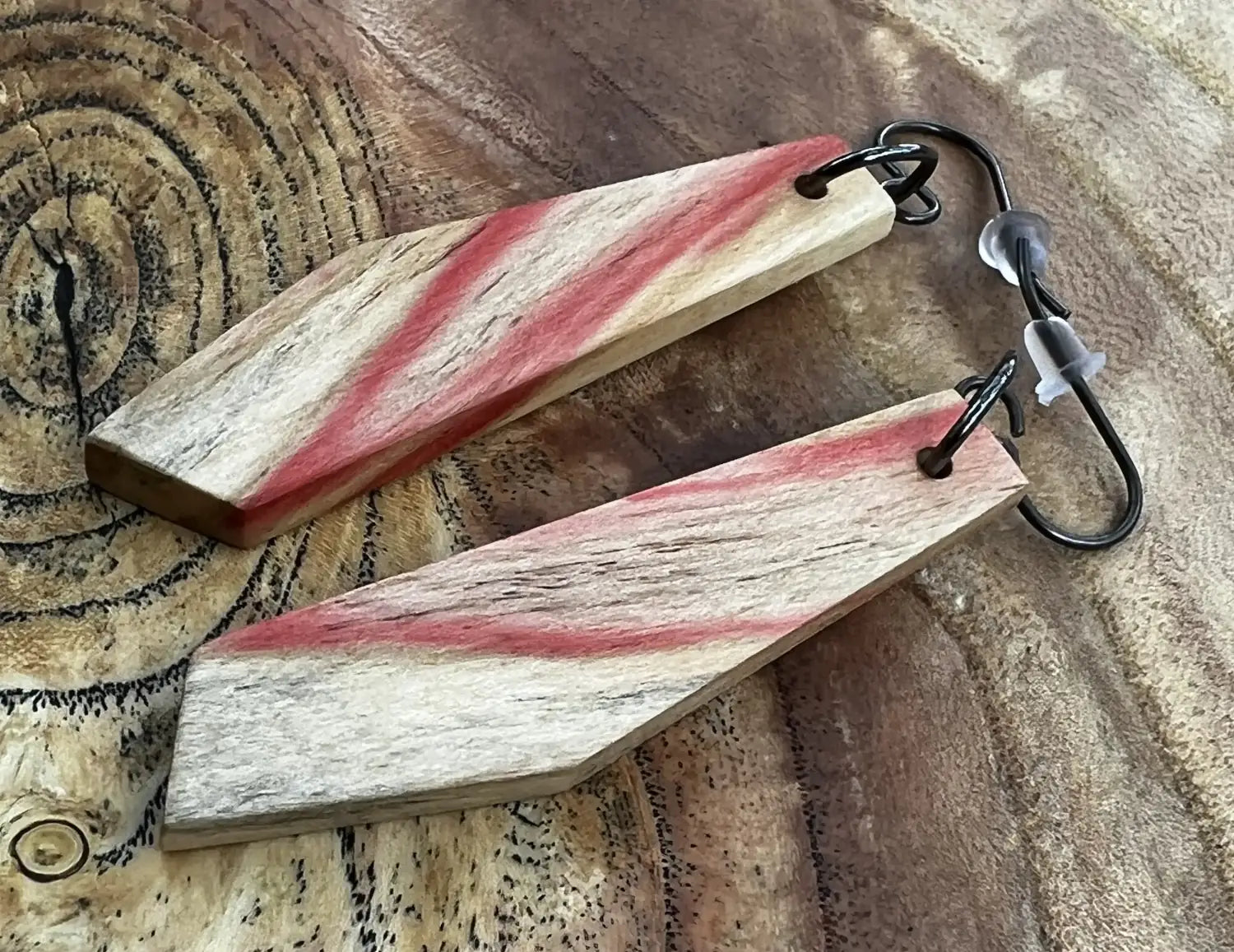 Flamed Box Elder earring with red streaks on a piece of Siberian elm with spalting